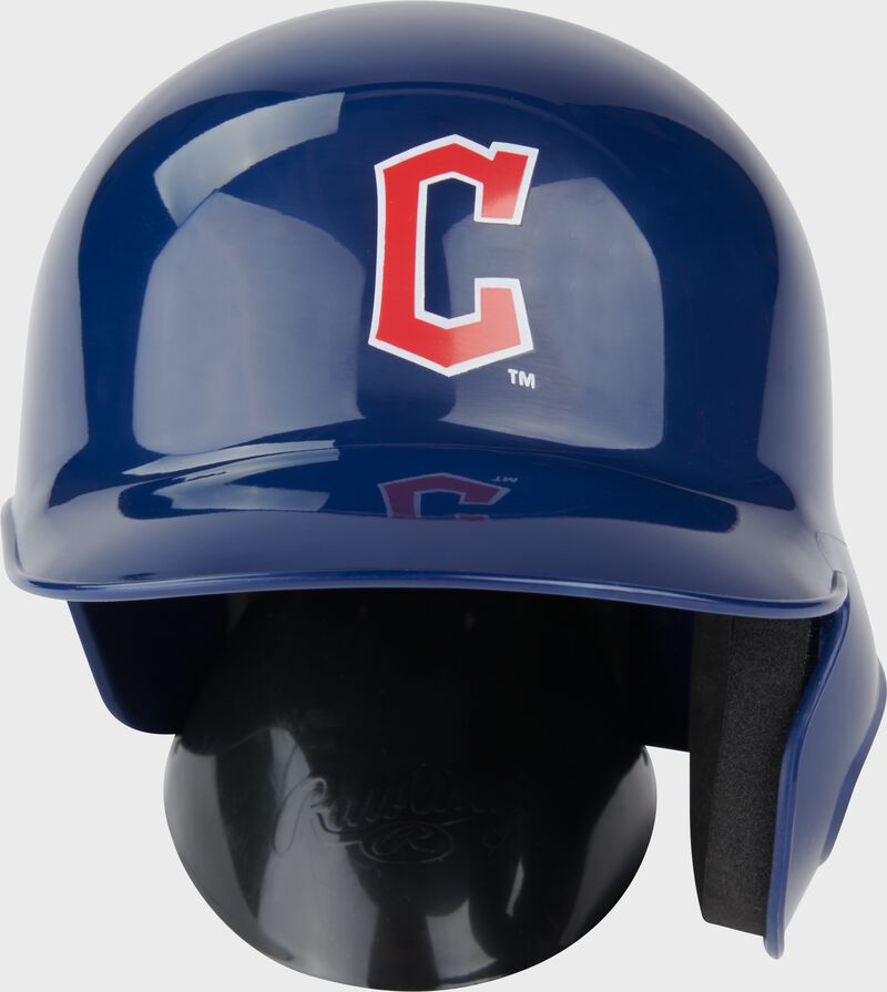 A navy Cleveland Guardians mini replica helmet