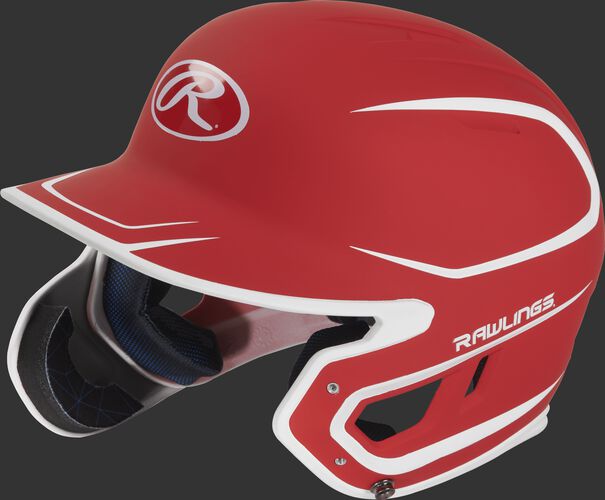 Left angle view of a MACHEXTR Rawlings Mach EXT Senior helmet with a two-tone matte scarlet/white shell