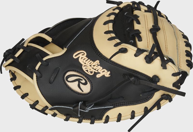 Thumb Side View of the 2021 Heart of the Hide 34-inch catcher's mitt. Features Yadier Molina color pattern