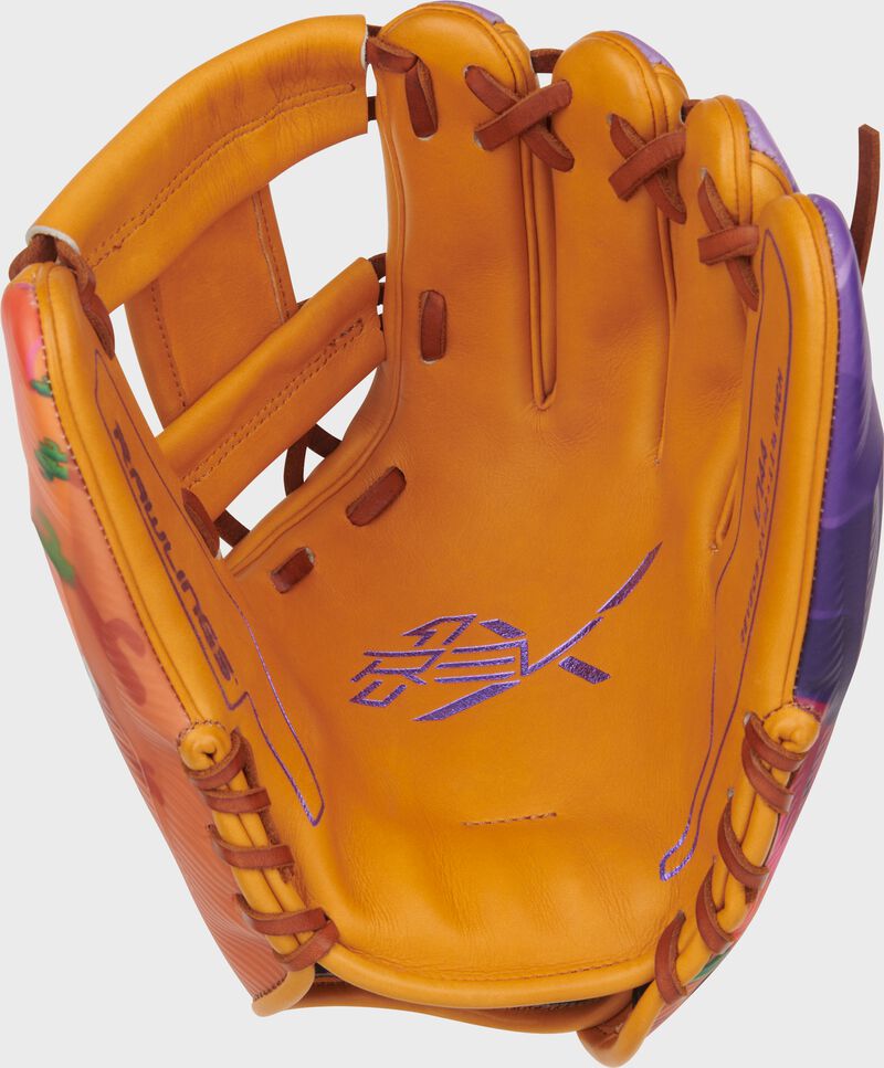 Tan leather palm of a Rawlings 11.75-Inch REV1X Arizona Spring Training Glove with purple stamping and purple laces