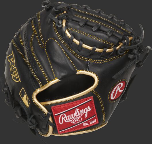 Back of a black 27-inch R9 Series training mitt with gold binding and a red Rawlings patch - SKU: R9TRCM
