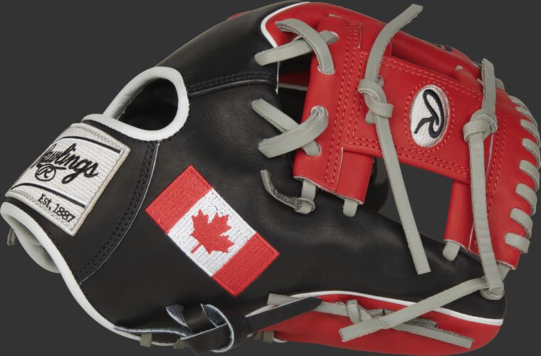 A black/scarlet PRO204W-2CA Heart of the Hide Canada infield glove with a scarlet I-web and Canadian flag on the thumb