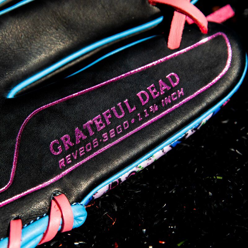 Picture of the purple "Grateful Dead" stamp on the pinky of a Rawlings Grateful Dead REV1X glove