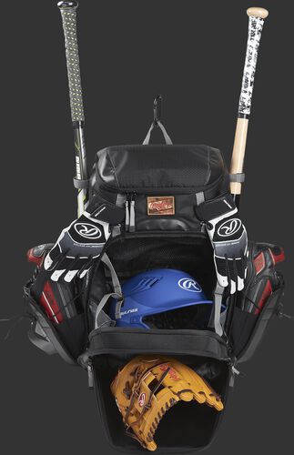 A black R1000 Rawlings Gold Glove bag with the main compartments open and filled with a helmet, glove, bats and cleats