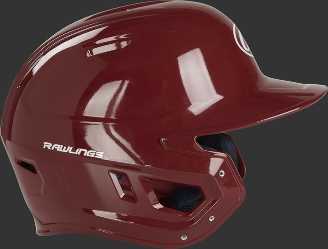 Right side ear flap of a MCH01A Rawlings Mach baseball batting helmet with a cardinal red shell