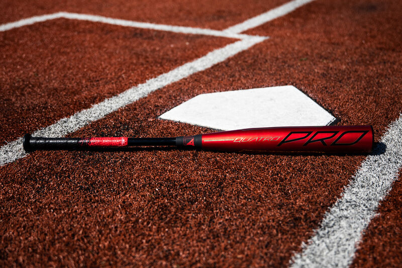 A 2020 Quatro Pro BBCOR bat lying next to home plate - SKU: BBZQ3