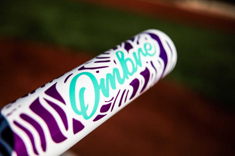 Barrel of a Rawlings Ombre -11 softball bat with a field in the background - SKU: FPZO11