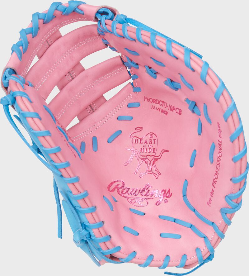 Pink palm of a Heart of the Hide ContoUR Fit 12.25-Inch 1st Base Mitt with Columbia blue laces