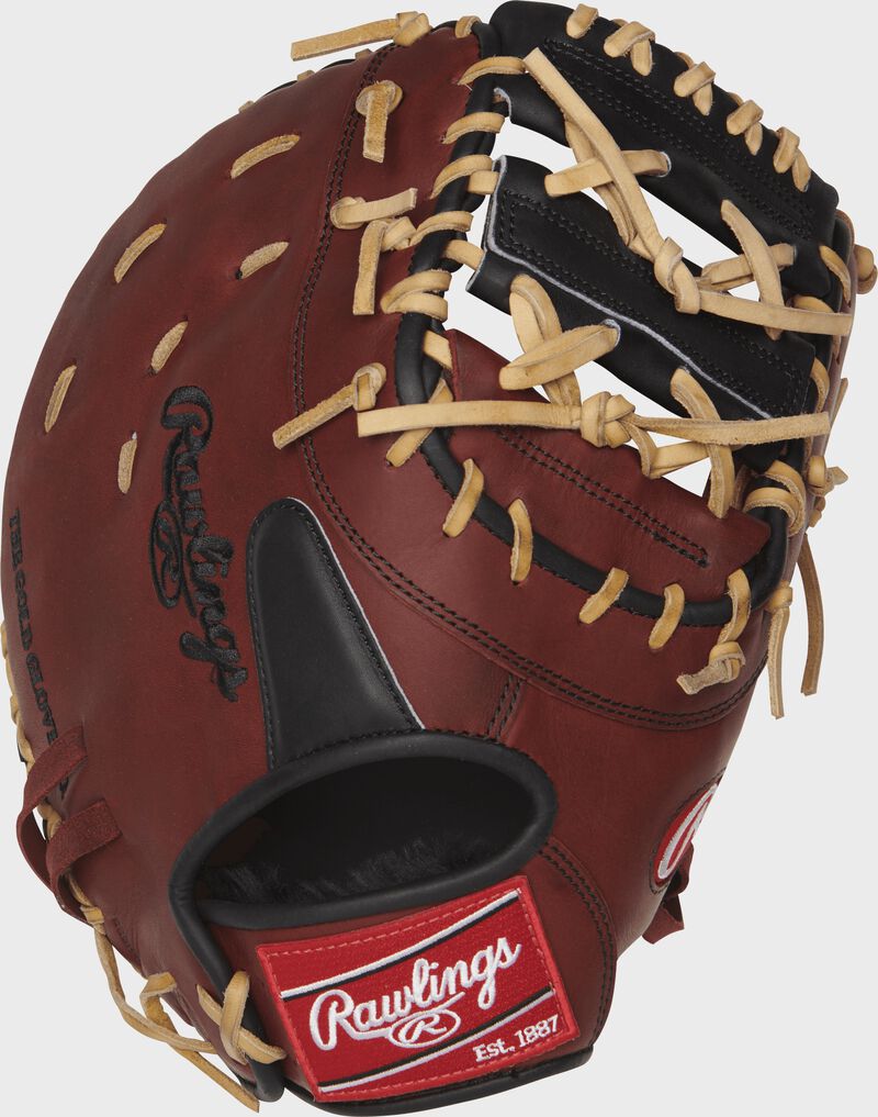 Burgundy back of a 12. 75 inch Heart of the Hide 1st base mitt with a black finger pad and red Rawlings patch - SKU: PROCMHCP22PRO