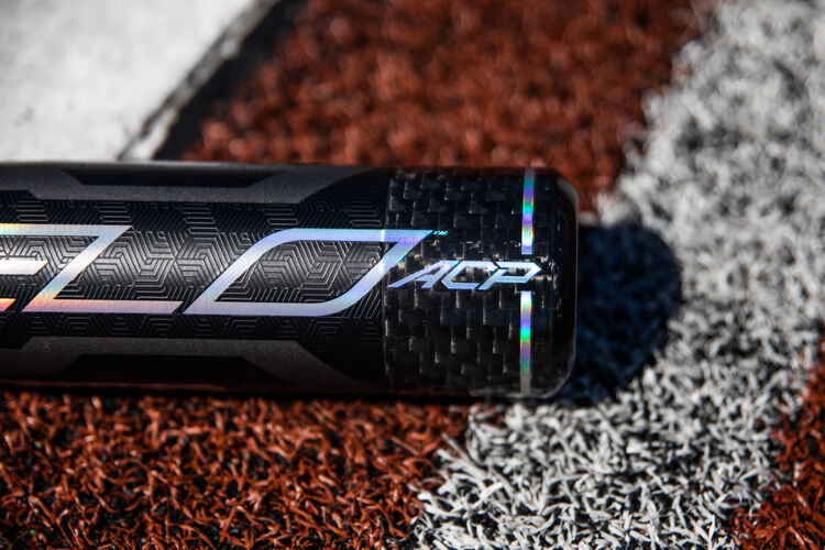 Velo ACP end cap on a USA bat lying next to home plate - SKU: USZV10
