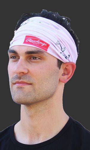 A guy wearing a pink stitch multi-functional neck gaiter as a head band - SKU: RC40001-681