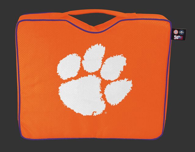 An orange NCAA Clemson Tigers bleacher cushion with a white team logo printed on the top