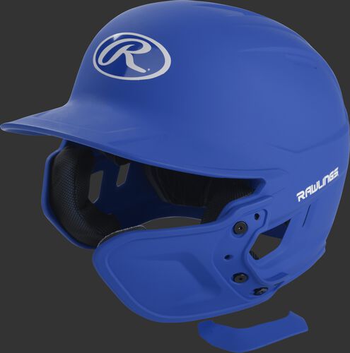 A matte royal MEXT attached to a Mach batting helmet showing the hardware