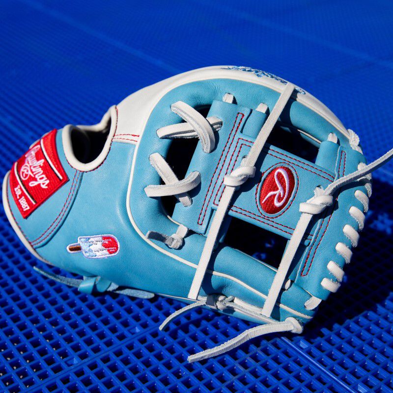 Columbia blue thumb of a Fro-Glo Heart of the Hide glove with a blue background loading=