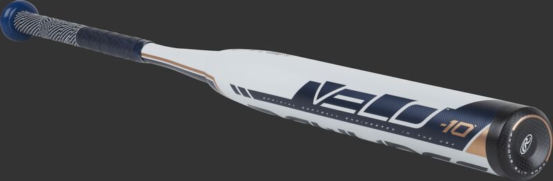 3/4 view of a FP9V10 Rawlings Velo fastpitch bat with a white barrel and black end cap