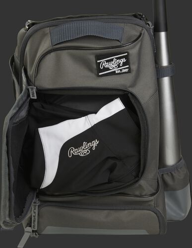 Locker style compartment of a grey R701 baseball training bag with a jacket in the pocket