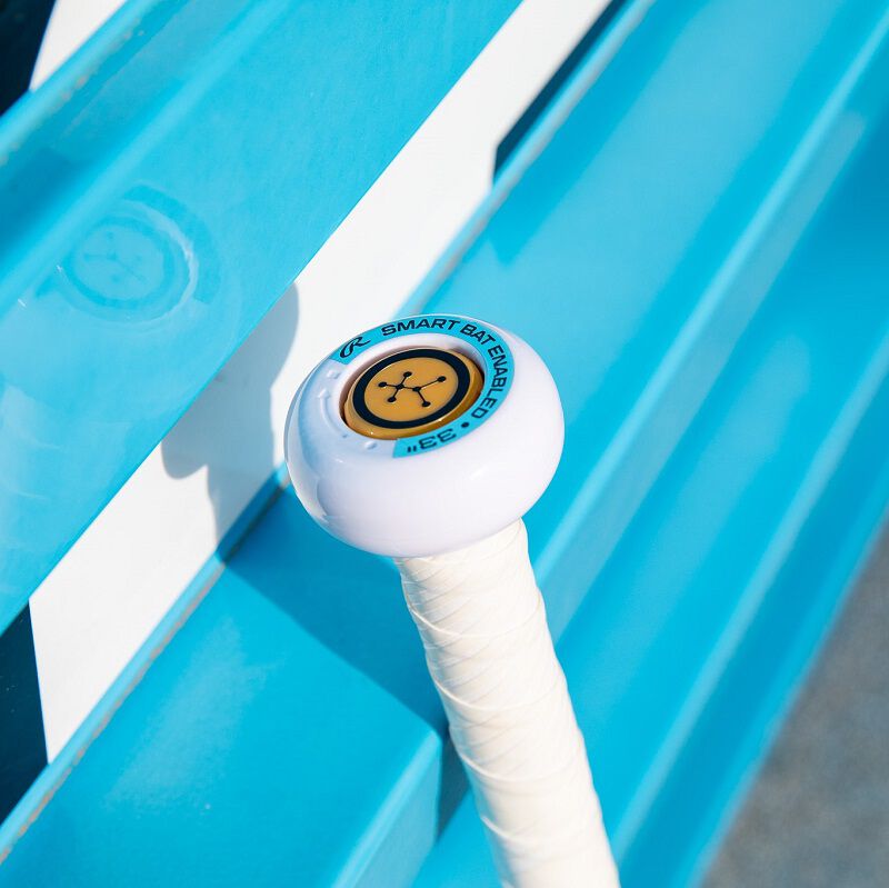 Blast motion enabled knob on a Rawlings Mantra Plus+ fastpitch bat leaning against a blue bench - SKU: RFP3MP