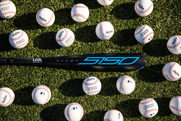 A Rawlings USA -5 5150 bat on a field with baseballs around it - SKU: US155