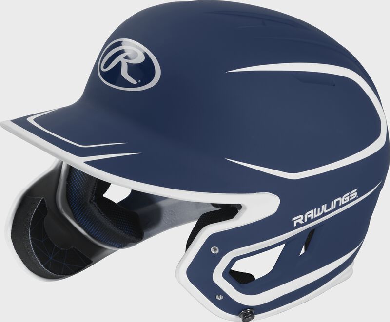 Left angle view of a MACHEXTR Rawlings Mach EXT Junior helmet with a two-tone matte navy/white shell