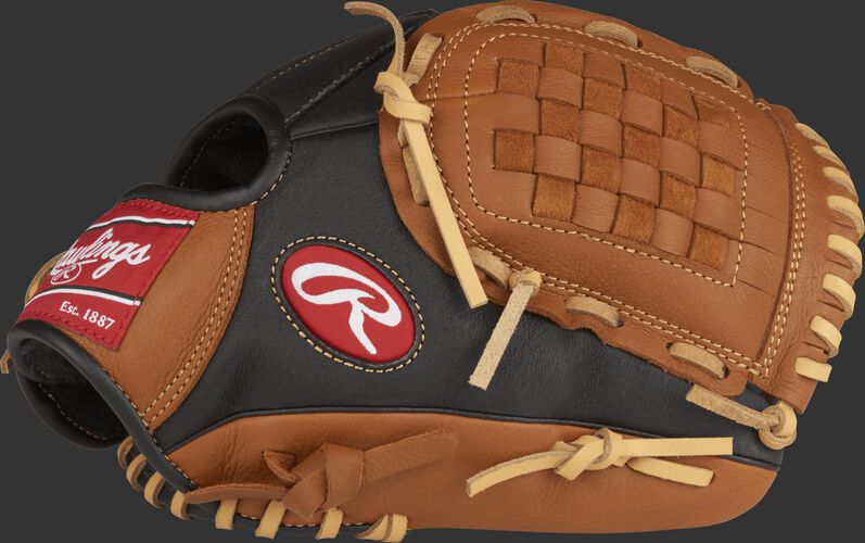 Thumb view of a black P110GBB Prodigy 11-inch youth infield glove with golden brown trim and Basket web