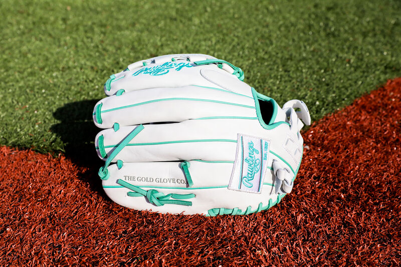 A white Rawlings Liberty Advanced Color Series glove on a field - SKU: RLA120-3WM loading=