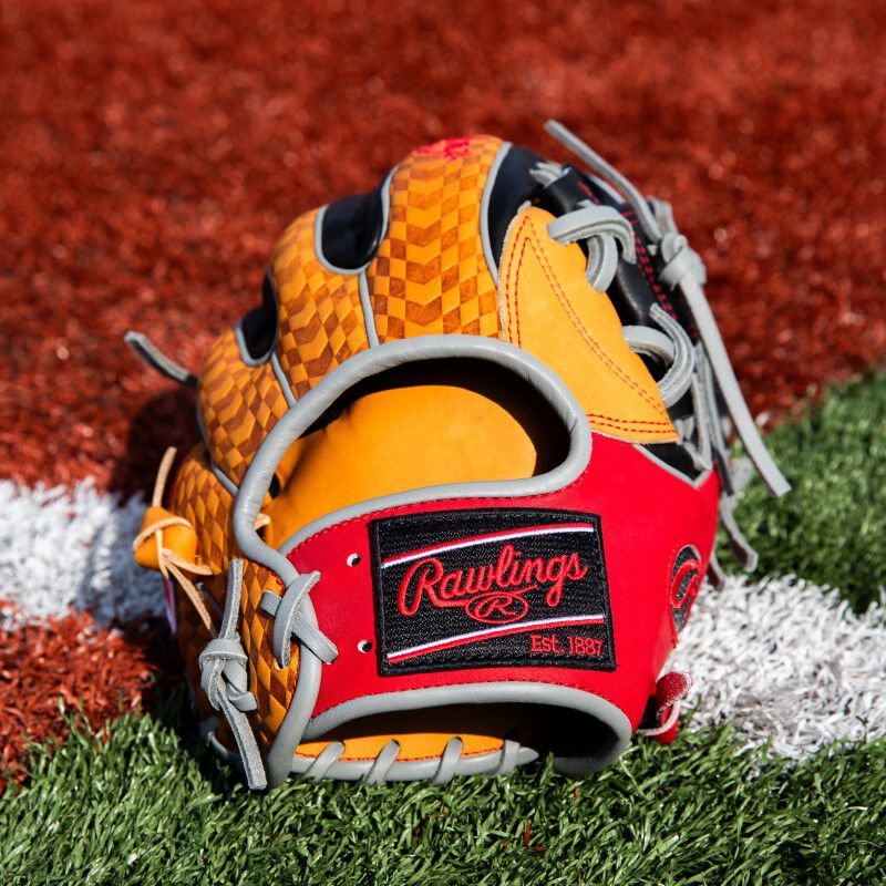 Black Rawlings patch on a ColorSync 8.0 Heart of the Hide infield glove on a field