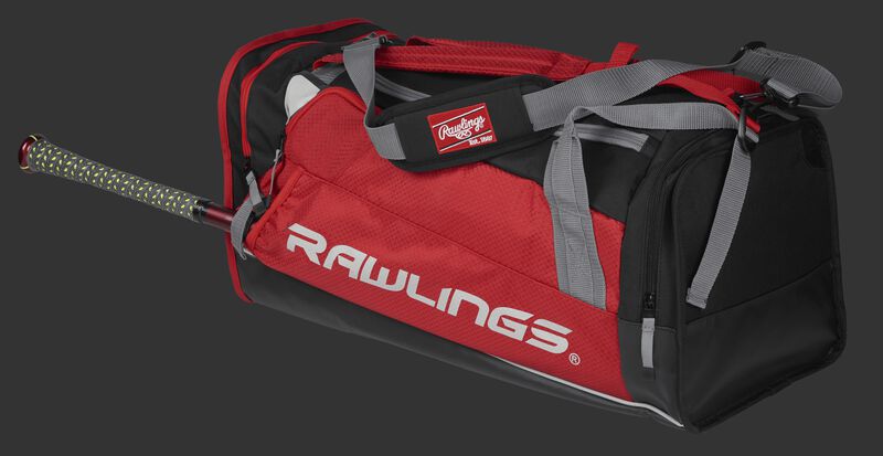 Side angle view of a scarlet R601 Hybrid players duffel bag with a bat in the side sleeve