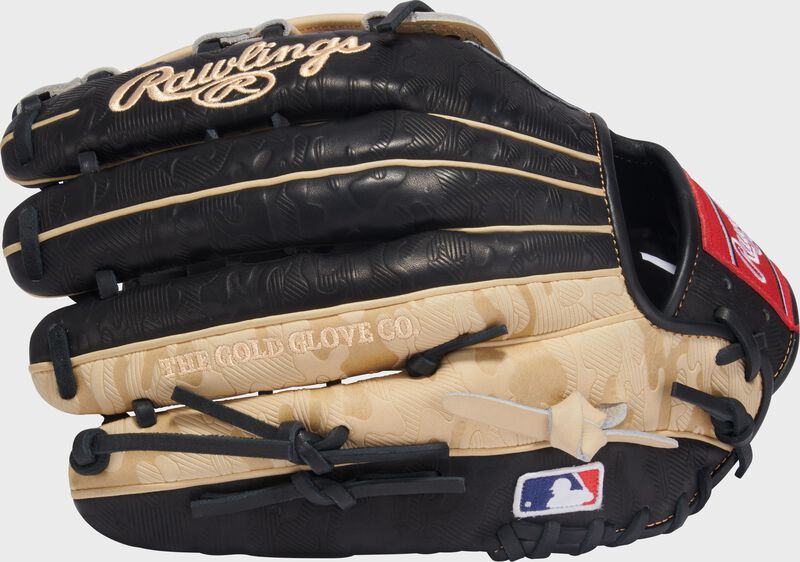 Back of a black/camel Gameday 57 Series Fernando Tatís Jr. Heart of the Hide Glove with the MLB logo on the pinky