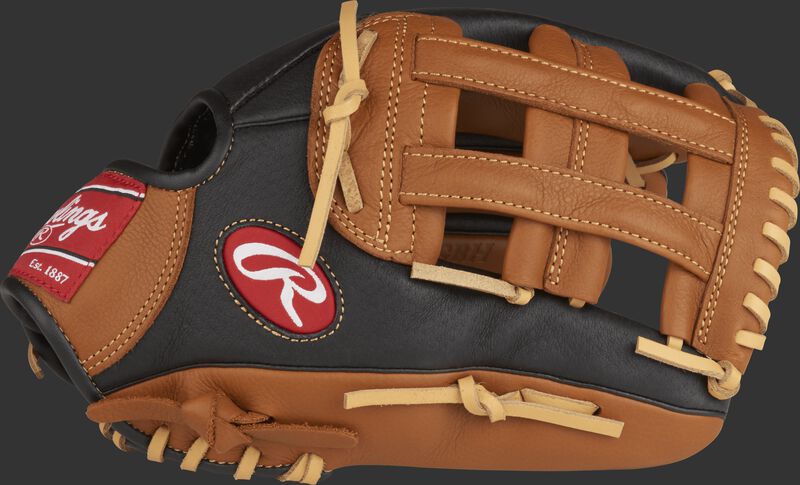 Thumb view of a P120GBH 12-inch Prodigy youth outfield glove with a black thumb, golden brown trim and golden brown H web