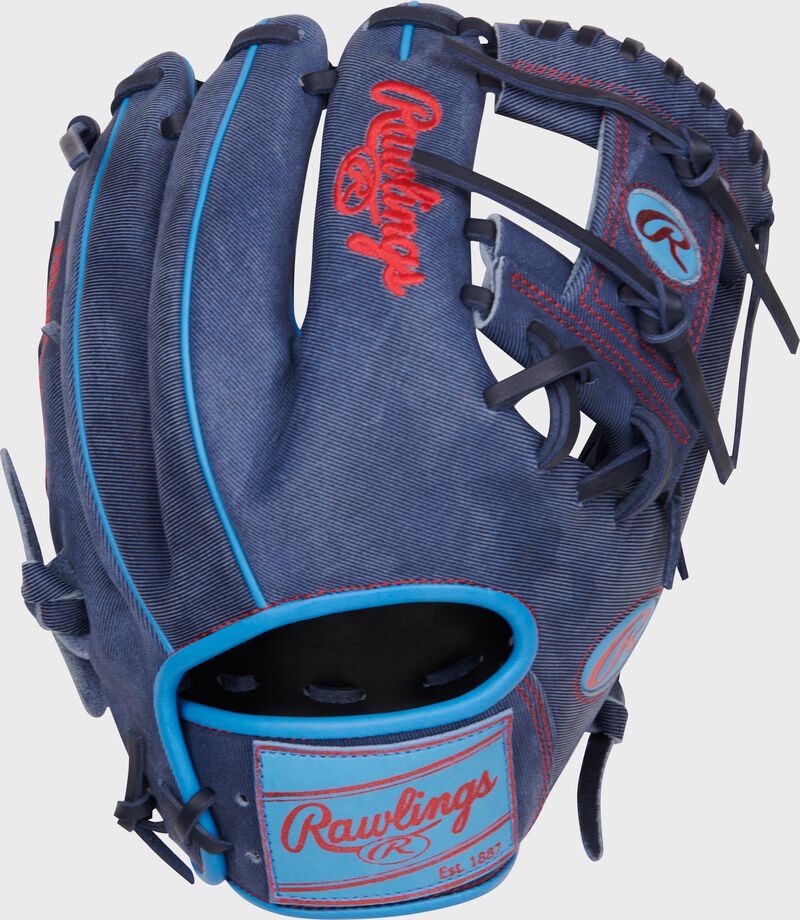 Denim back of a Heart of the Hide Pro Label denim infield glove with a Columbia blue leather patch