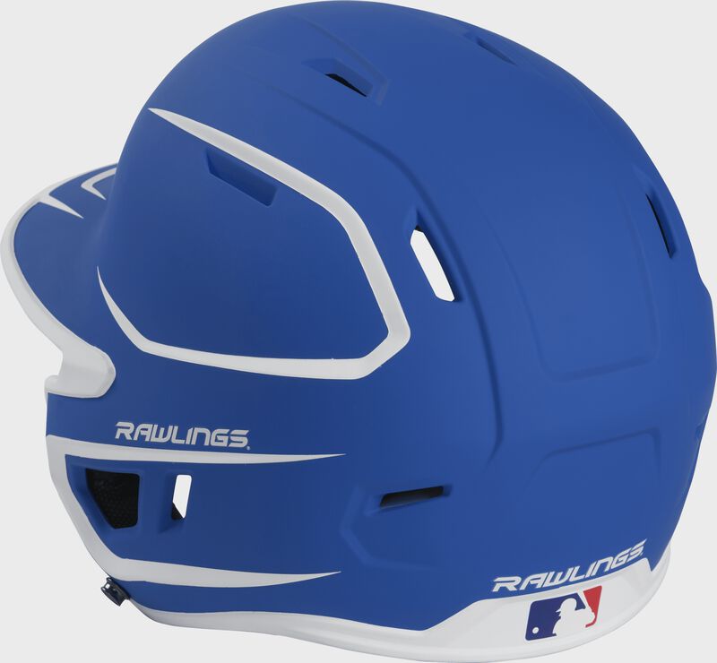 Back left view of a matte royal/white MACHEXTR MACH series two-tone batting helmet with air vents