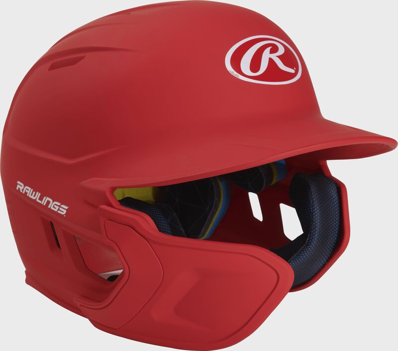 Right angle view of a matte scarlet MACHEXTL Mach Junior helmet with Mach EXT left hand batter face guard extension