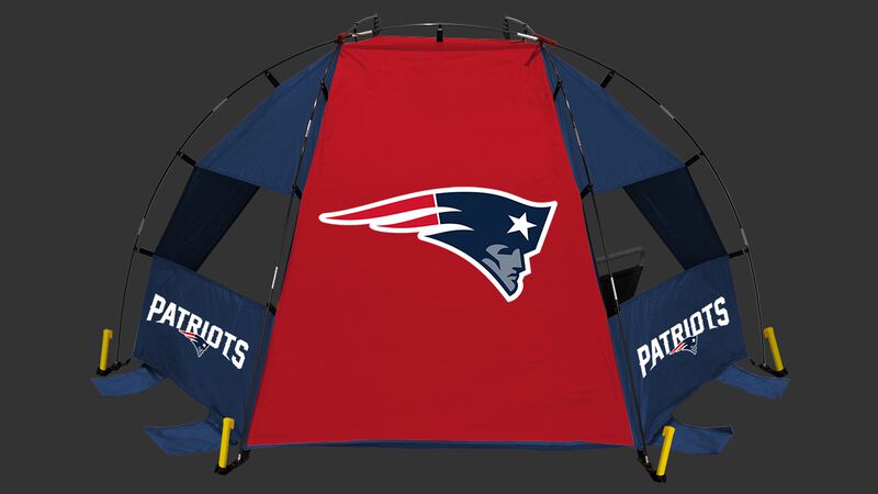 A New England Patriots sun shelter set up on a beach with a chair, football, cooler and water bottle - SKU: 00961076111