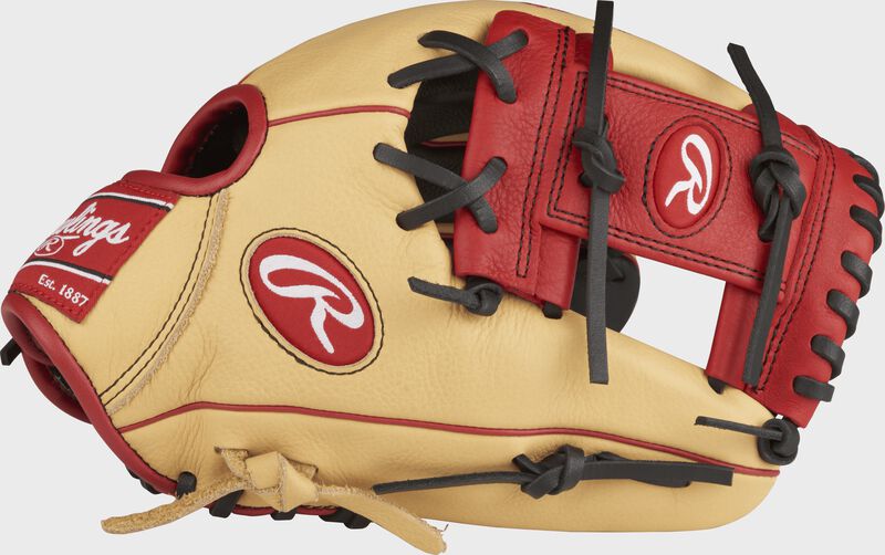 Thumb view of a camel SPL112AR 11.25-inch Select Pro Lite Addison Russel youth infield glove with a scarlet I web