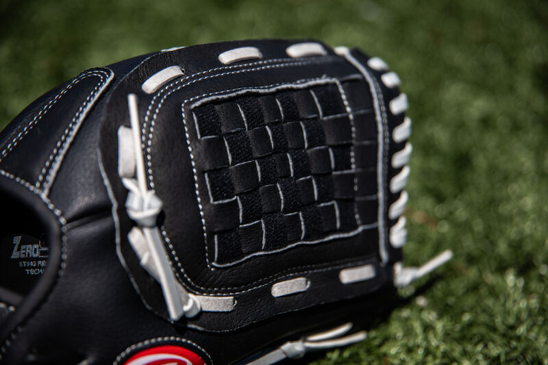 Black Basket web of a Rawlings RSB softball glove with a field in the background - SKU: RSB120GB