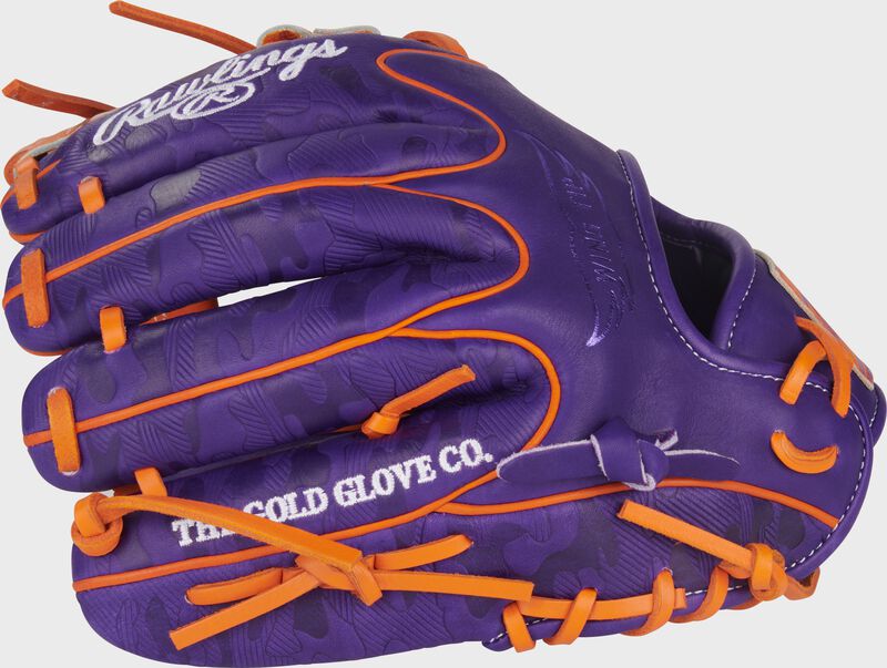 Purple back of a Heart of the Hide ContoUR Fit 11.5-Inch Wing Tip Glove with the MLB logo on the pinky