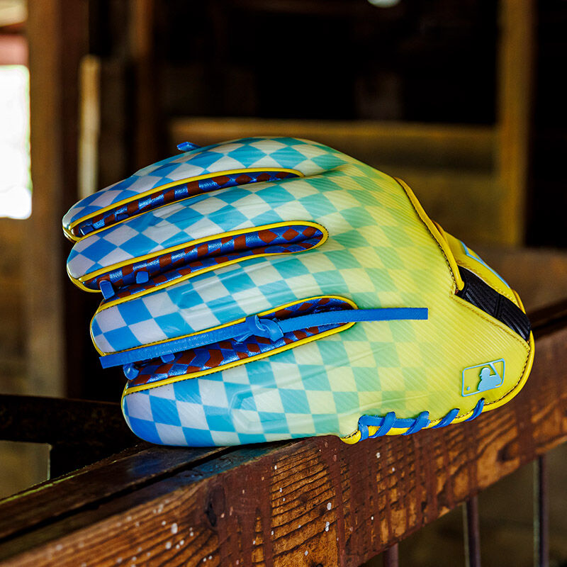 Back of a Rawlings Race Day REV1X infield glove at a horse stable