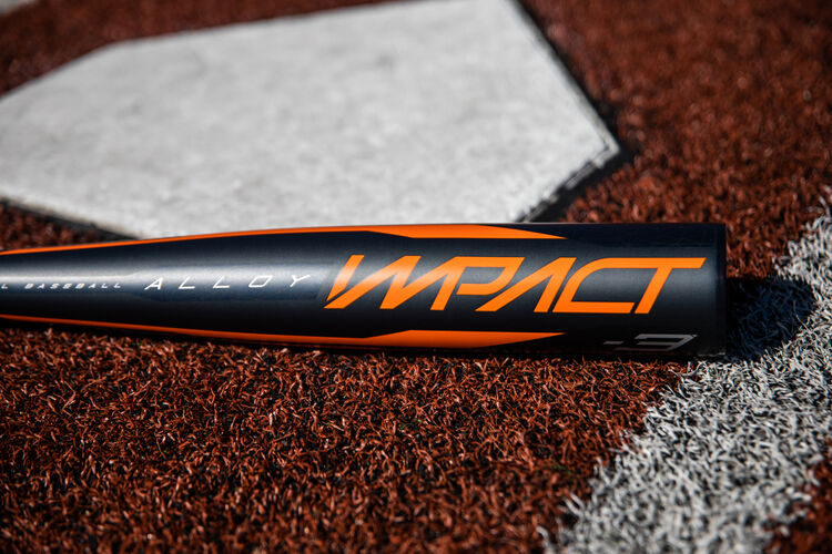Barrel of a BBCOR Impact bat lying beside home plate - SKU: BBZI3