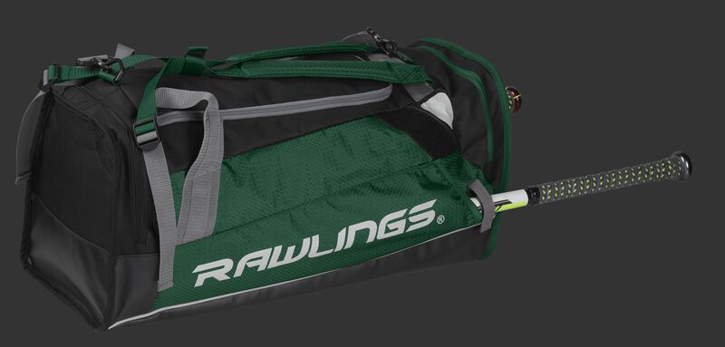Side angle view of a dark green R601 Rawlings Hybrid backpack/duffel bag with a bat in the side compartment