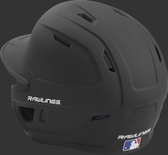 Back left view of a matte black MACH series batting helmet with air vents