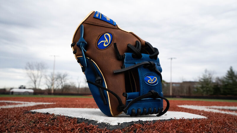 A 2020 Heart of the Hide exclusive infield glove standing up on home plate with a royal I-web - SKU: PRO204W-2TIR