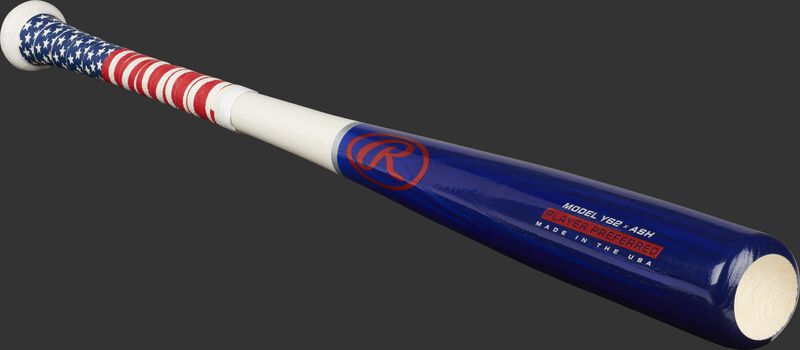 Angled view of a Player Preferred youth ash bat with a red, white and blue design and cupped end - SKU: Y62AUS