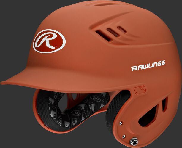 A burnt orange R16M Velo batting helmet with Cool-Flo vents