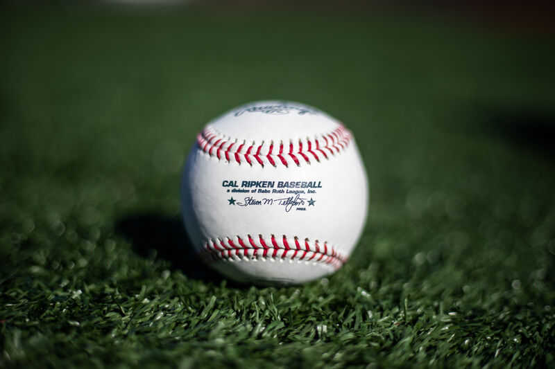 A Cal Ripken league baseball lying in the grass on a field - SKU: RCAL1