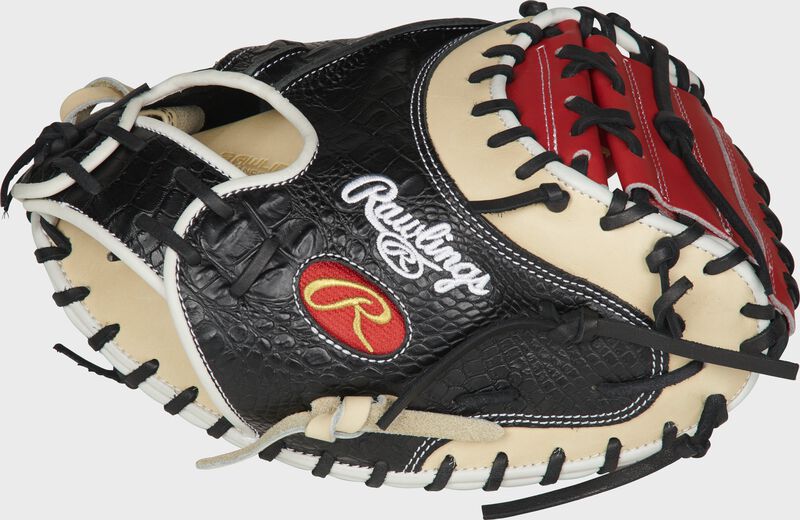 Thumb of a black/came PROYM4SCC Heart of the Hide ColorSync 34-inch catcher's mitt with a scarlet one-piece solid web