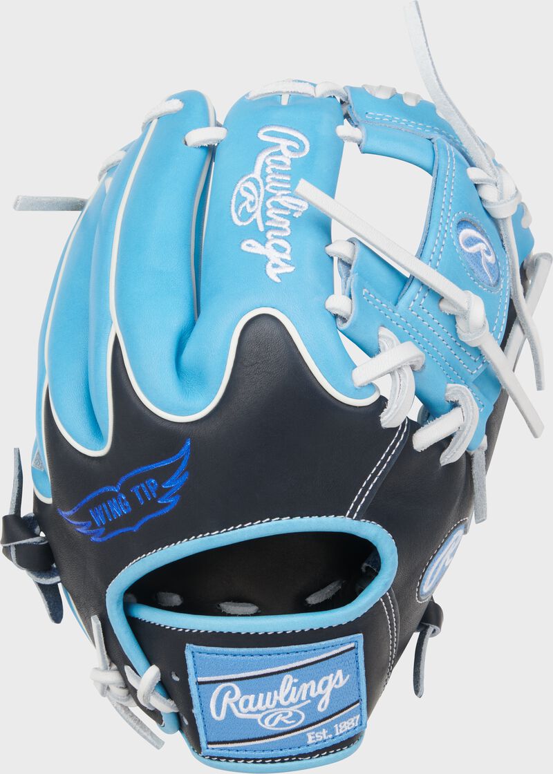 Wing tip back of a Rawlings Heart of the Hide 11.75-Inch Wing Tip Infield Glove with a Columbia blue Rawlings patch