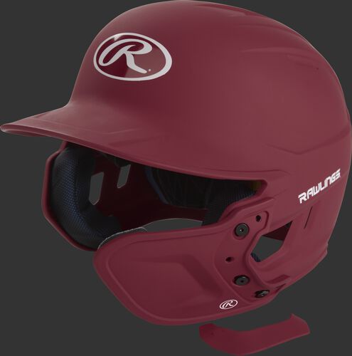 A matte cardinal MEXT attached to a Mach batting helmet showing the hardware