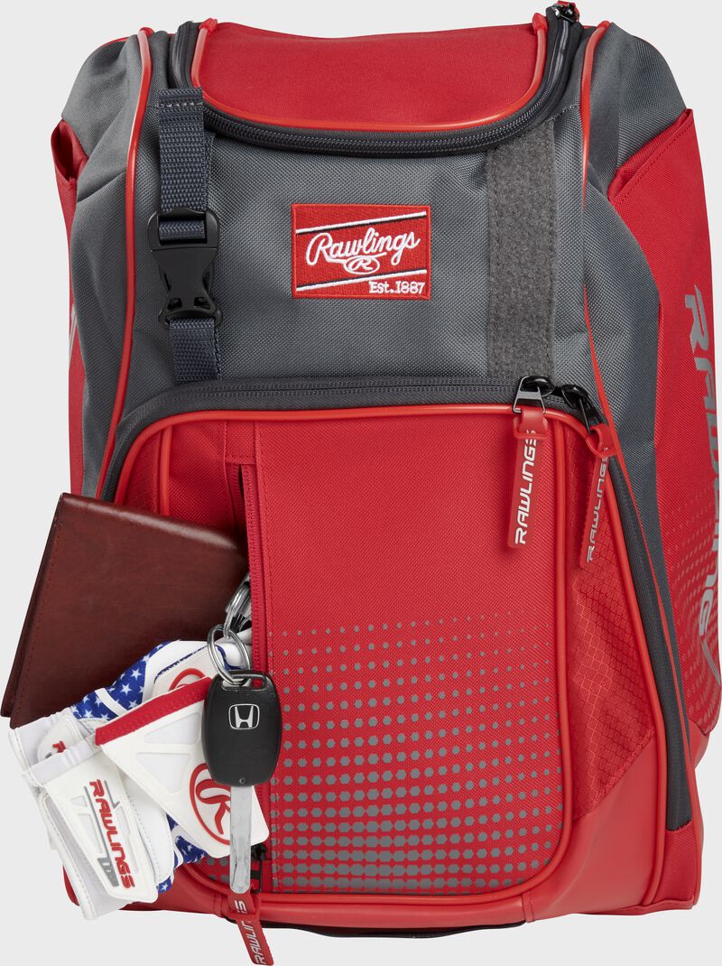 Wallet, keys, and batting gloves in the front valuables pocket of a scarlet Franchise baseball bag - SKU: FRANBP-S
