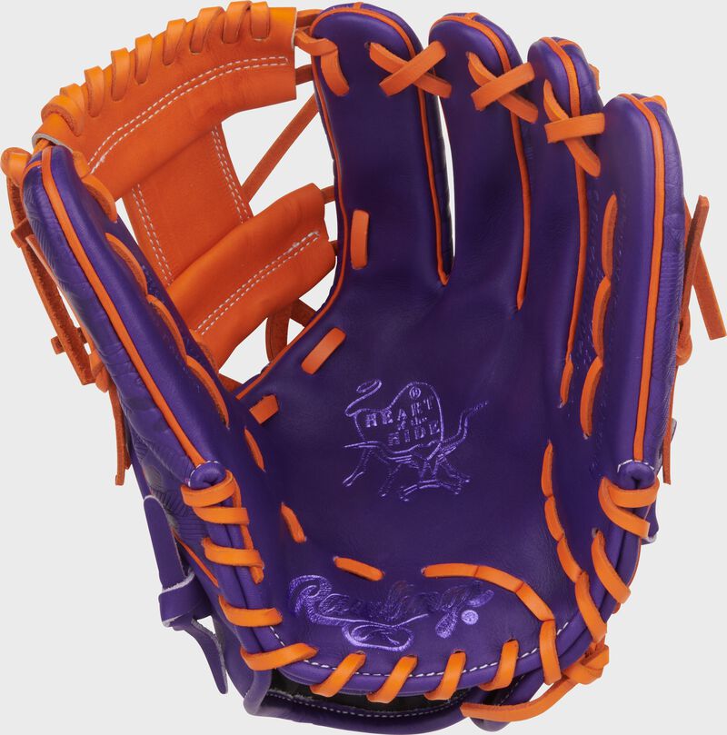 Purple palm of a Heart of the Hide ContoUR Fit 11.5-Inch Wing Tip Glove with orange laces