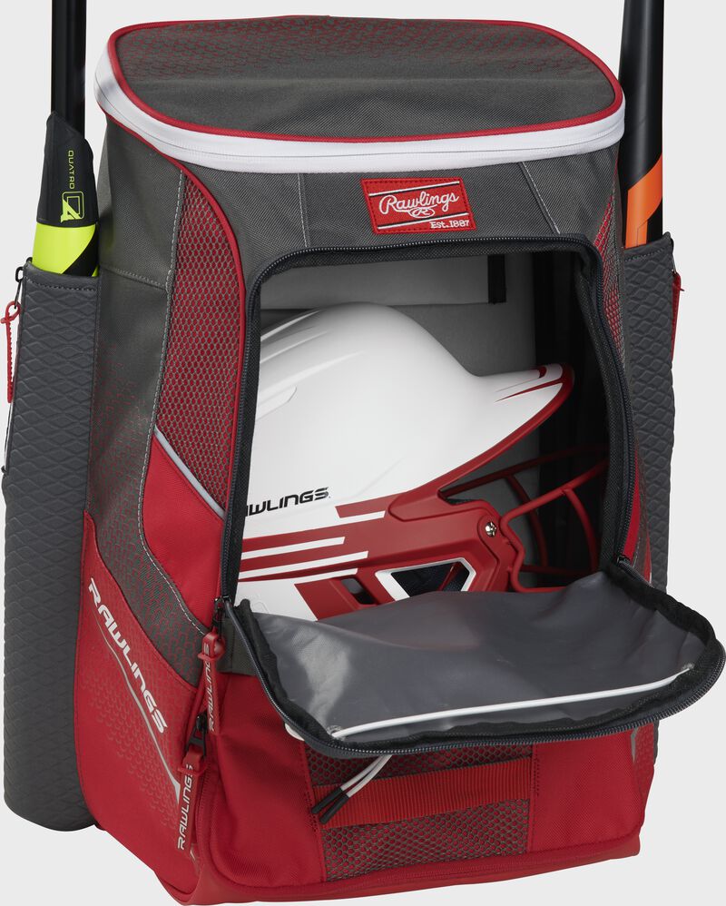 A scarlet Impulse baseball backpack with a helmet in the main compartment - SKU: IMPLSE-S